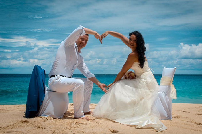 This photo shows a gleeful couple at the beach Praslin